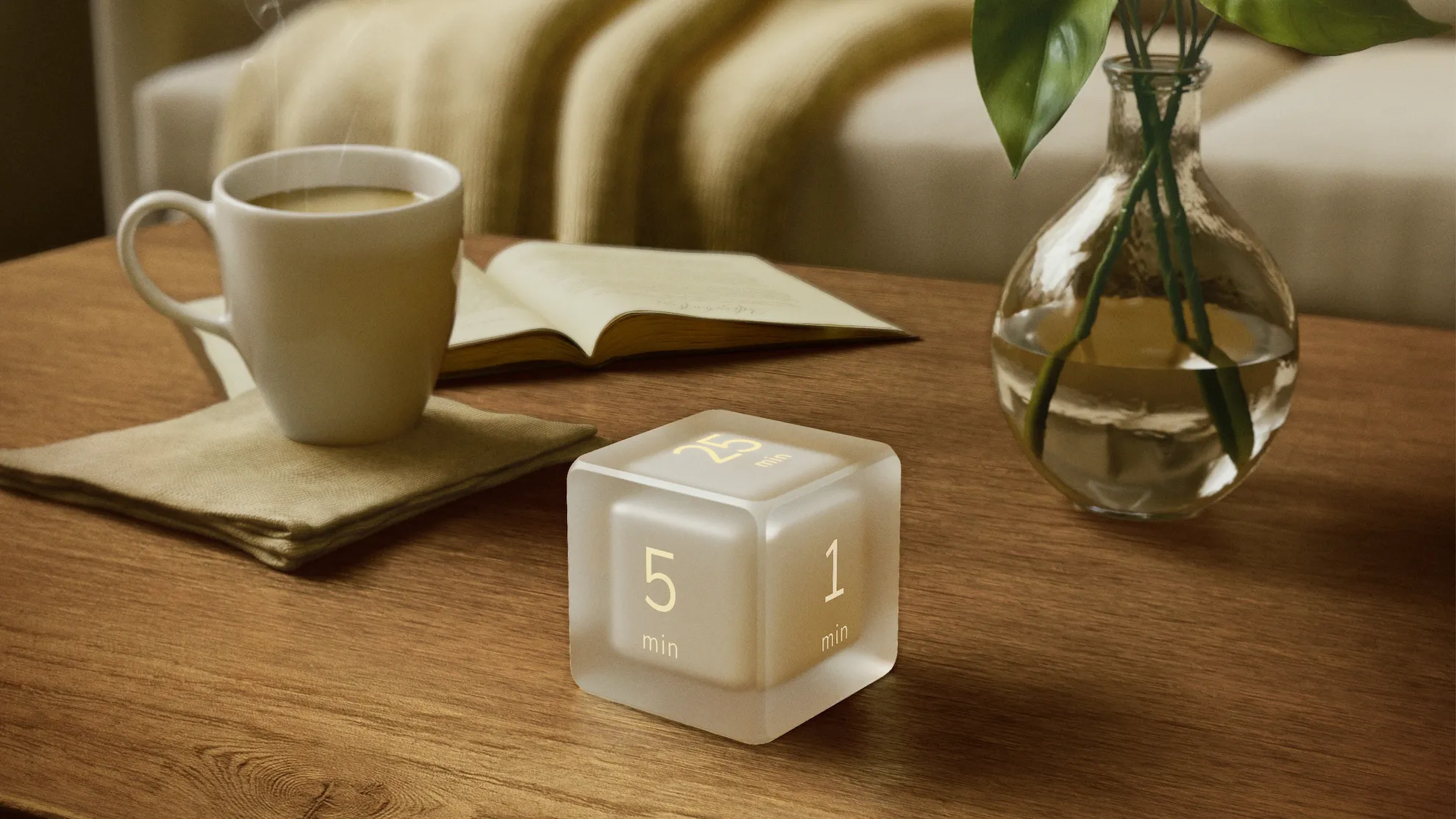 Settledy timer resting on a wooden desk beside morning coffee and an open book